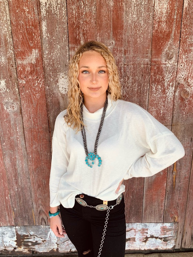 White turtle neck sweater