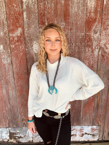 White turtle neck sweater